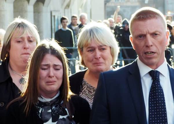 Rebecca Rigby (second left), the wife of Fusilier Lee Rigby, weeps as a statement is read out by Detective Inspector Pete Sparks (right) after Michael Adebolajo and Michael Adebowale were found guilty of his murder. PRESS ASSOCIATION Photo. Picture date: Thursday December 19, 2013. See PA story COURTS Woolwich. Photo credit should read: Max Nash/PA Wire