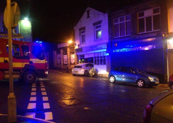 A white Volkswagen Scirocco ploughed through Olivers in Elland on Saturday night.Thanks to reader Rachael Davis for sending in this dramatic image.