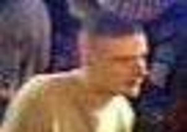 Huddersfield CID would like to speak to the man pictured in the long sleeved grey top regarding an assault at a pub in Huddersfield