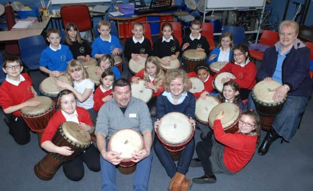 NADV 1402112AM1 Starbeck School pupils in drumming rehersals for this years Harrogate Festival are seen here with their teacher Andrew Stratford, Louisa Webb(Festival director) and Cllr. Janet Law. Picture : Adrian Murray. (1402112AM1)