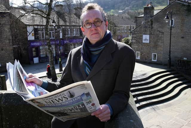 Poet Winston Plowes in Hebden Bridge, with the Todmorden News,  the publication he will be using along with the Hebden Bridge Times, Halifax Courier and Brighouse Echo, among others, in the project