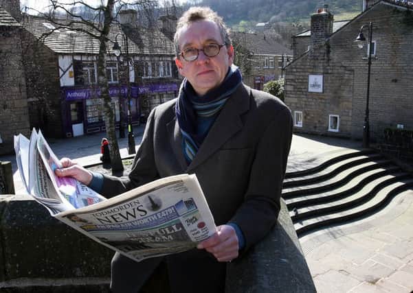 Poet Winston Plowes in Hebden Bridge, with the Todmorden News,  the publication he will be using along with the Hebden Bridge Times, Halifax Courier and Brighouse Echo, among others, in the project