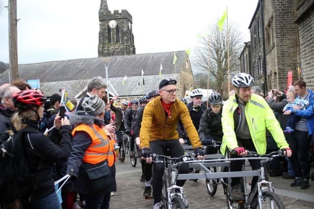 Cyclists depart Mytholmroyd Community Centre pulling a mini-grand piano up Cragg Vale, the longest continuous incline in England. Part of the Tour de France Grand Depart, Yorkshire Festival