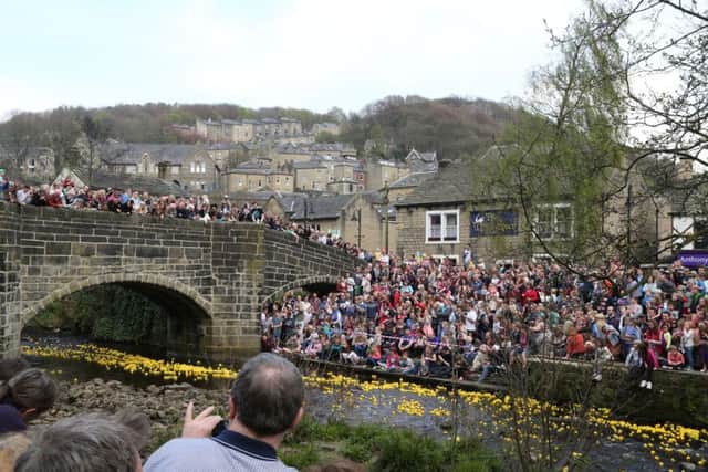Some of the crowds packing Hebden Bridge for the Rotary Club's annual Duck Race