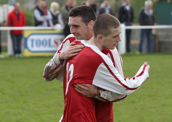 Queens Head's Blake Gallagher and hat-trick ace Luke Eastwood.