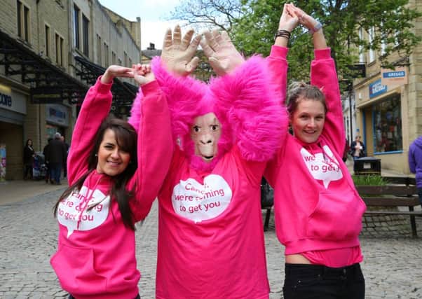 Cancer Research UK doing dance to promote the Race for Life at The Woolshops Shopping Centre, Halifax.
From the left, Emma Colbourne, Sarah Threadgall as the Race for Life Gorilla and Philippa Sharpe.