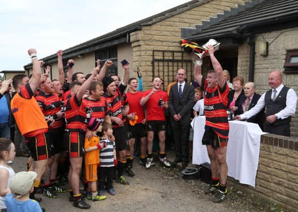 Brighouse Rangers Captain Scott Bradley lifts the Fee Cup