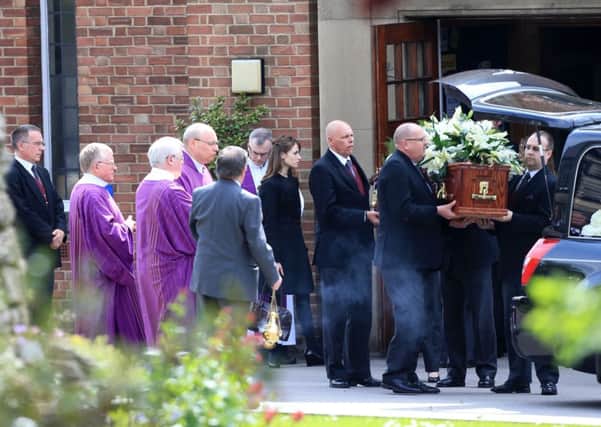 The coffin of Ann Maguire leaves the Catholic Church of The Immaculate Heart of Mary in Leeds. PIC: PA