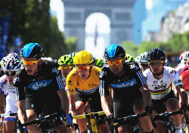 File photo dated 22/07/12 of Great Britain's Bradley Wiggins of Sky Pro Racing (yellow jersey), rides with team mates Mark Cavendish (right), Chris Froome (left) and Bernhard Eisel (second left). PRESS ASSOCIATION Photo. Issue date: Sunday December 16, 2012. Not only did Wiggins deliver a first British Tour de France victory, but he did so with elan. See PA story SPORT Christmas Cycling Wiggins. Photo credit should read: PA Wire