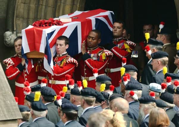 The coffin of Fusilier Lee Rigby is carried from Bury Parish Church following his funeral service