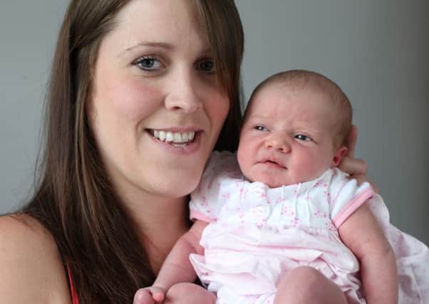 Kimberley Walters and new born daughter Erin at Grove Street, Bolton Brow.