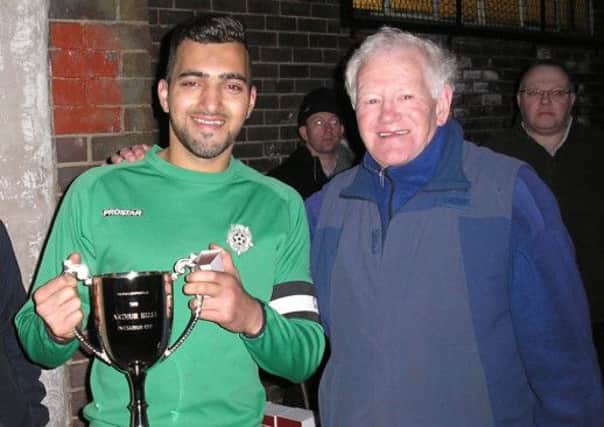 Happier times: Spring Hall's Ahsan Farooq receives the Invitation Cup from AFL President Michael Sheppard.