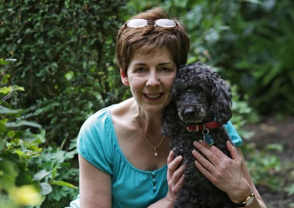 Jane Baker  reunited with DARCY THE POODLE