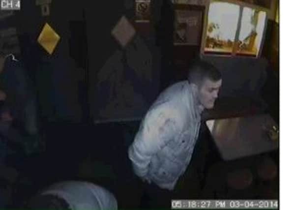 Police have issued this image of a man they would like to speak to after cash was stolen from the Dirty Dicks public in Halifax