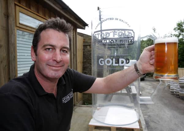 Angus Wood at the Stod Fold Brewing Company, Ogden prepares for the world record attempt for world's largest glass of beer.