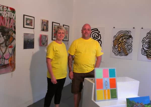 Christine Nichol, with markets manager Peter, at the Pop Up Gallery at Todmorden Market, Brook Street, opened for the Tour De France