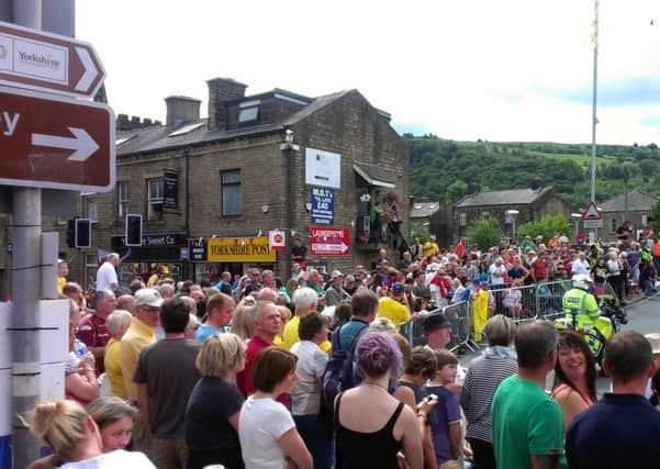Crowds line the Tour de France route in Mytholmroyd