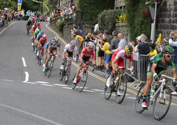 The Tour de France peloton race through Hebden Bridge.
