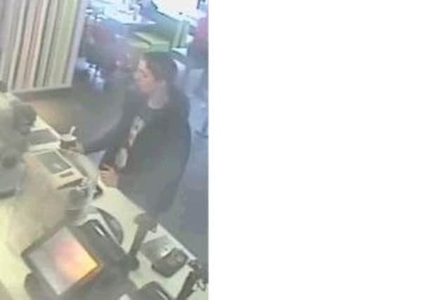 Police want to speak to this man in connection with the tehft of a purse from McDonald's on Bradford Road, Brighouse, on May 30