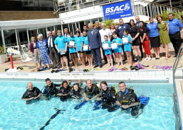 Emma Lawrence, third from left, of Wadsworth, Hebden Bridge, with the Duke of Cambridge, Prince Charles and fellow scuba divers at a special event to mark the handover of the presidency of the British Sub-Aqua Club