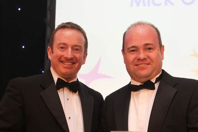 Lee Kenny (left) from Snowflake Media, presents Mick O'Neill with award for Investment in the Community, at the Halifax Courier Community Spirit Awards 2012, at Berties, Elland