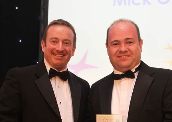 Lee Kenny (left) from Snowflake Media, presents Mick O'Neill with award for Investment in the Community, at the Halifax Courier Community Spirit Awards 2012, at Berties, Elland