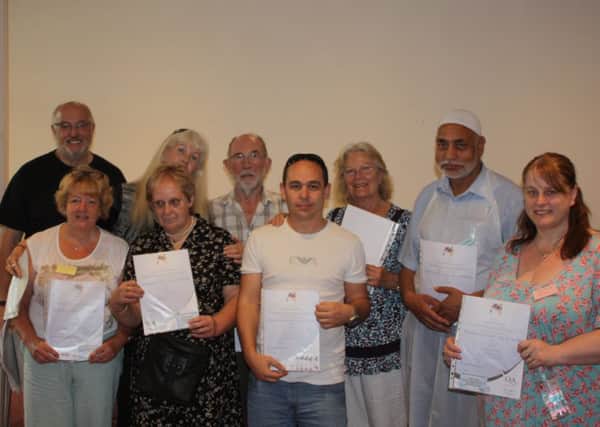 Volunteers at the Christians Together Food and Support Drop In Centre, Halifax, with their certificates. 
Jeff Heaton (Administrator and Project Co-ordinator with Christians Together), Cath Sykes, Tracey Lynch, Katherine Carmont, Peter Oates, Graham Chester, Jocelyn Bagwell, Mohammed Matloob, and Debbie Taylor.