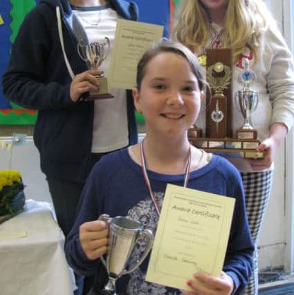 79th Annual Show of the Southowram
Horticultural and Allotments Society held at Withinfields School today
Pictured are  Grace Allen, Abigail Barlow and, at the front,
Beau Well.