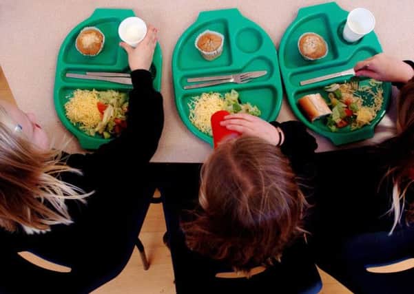 PARENTAL PERMISSION OBTAINED

File photo dated 08/03/07 of a pupils eating their school dinners, as a new survey suggests that councils and schools are being forced to raid existing budgets to ensure that a Government scheme to offer free school lunches to infants goes ahead. PRESS ASSOCIATION Photo. Issue date: Tuesday August 19, 2014. Under plans first announced by Deputy Prime Minister and Lib Dem leader Nick Clegg last year, all five to seven-year-olds will be entitled to the meals from this September. See PA story EDUCATION Meals. Photo credit should read: Chris Radburn/PA Wire