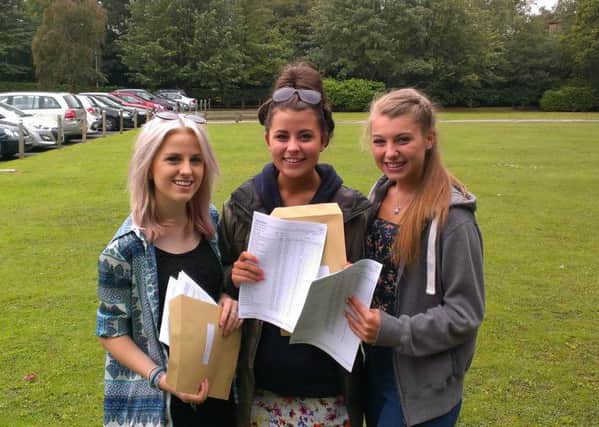 Lydia Chandler, Kitty Watson, and Eve Connolly receiving their GCSE results from St John Fisher Catholic High School.