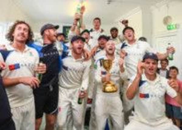 Yorkshire players celebrate winning the County Championship