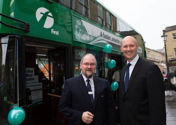 Chris Armour and Brandon Jones, from First Bus, with the new green bus, in Halifax Town Centre