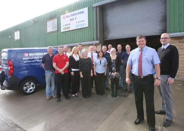 Alco Valves Group extending business to another unit near original premises.
Staff at Alco with managing director Stuart Lomax, second from right, and operations manager James Stangroom, right.