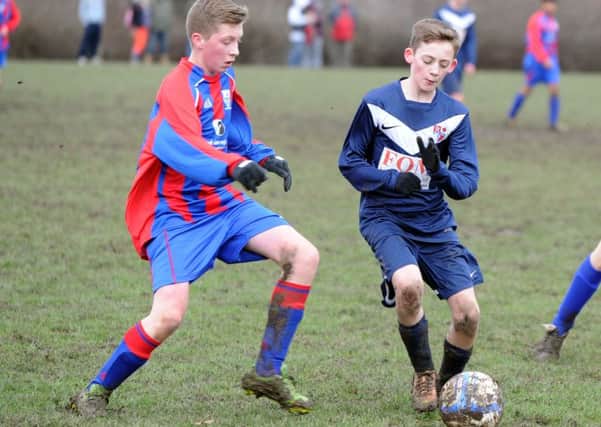 20 january 2014.
Battyeford U15's v Rastrick B U15's.
Huddersfield Junior Football League Division 4.
Battyeford's Callum Boyle, left, challenges for the ball watched by Jamie Turton in the 4-2 win for Battyeford.