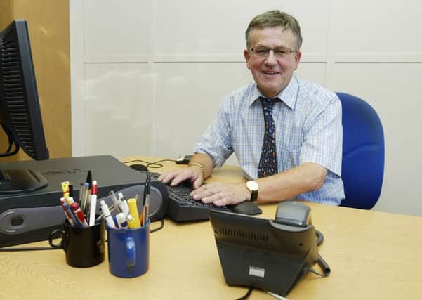Gordon Sampson at his desk in the Evening Courier office on the day of his retirement