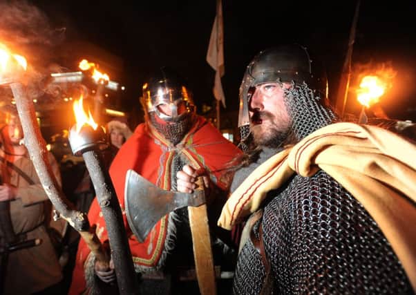A troupe of Vikings lead a torch-lit procession through Harrogate to open the second Harrogate History Festival. Picture Bruce Rollinson