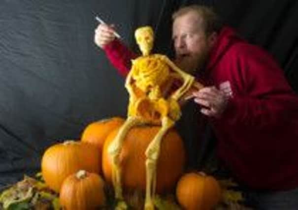 Jamie Wardley picture with his pumpkin sculptiure, Fred the Skeleton.