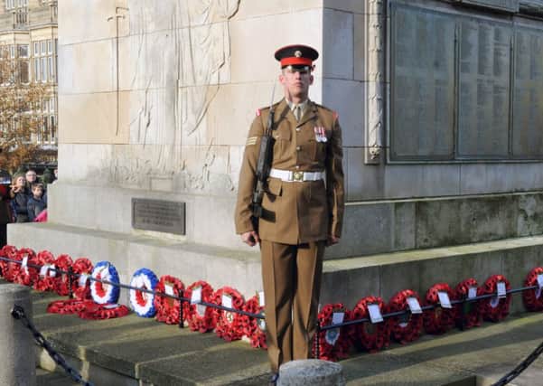 A soldier guards the war memorial in Harrogate  following the laying of poppy wreaths  on  Remembrance Sunday. picture by Gary Longbottom (GL1003/98h).