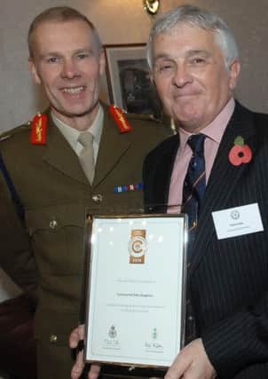 Knaresborough firm Continental Data Graphics joined nine other organisations across Yorkshire and the Humber to become the first in the country to be recognised as a Silver award holder under the governments new Employer Recognition Scheme for supporting the Reserve Forces. Pictured: Continenatal's Patrick Nulty receives the award from the UK's most senior reservist, Maj Gen John Crackett. (S)