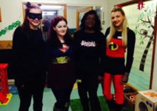 Staff at Hipperholme and Lightcliffe Day Nursery in their super hero outfits for Children in Need