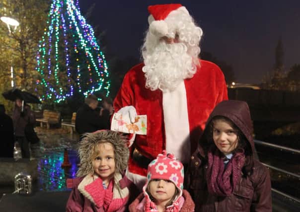 Christmas Lights switched on in Mytholmroyd. Santa with Alicia Wilcock aged four, Franseca Cox aged six and Isabelle Cox aged eight