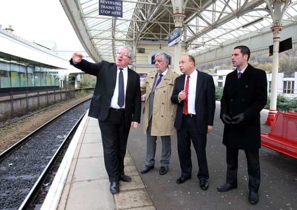Transport Secretary Patrick McLoughlin, Stephen Baines, Philip Allott and Scott Benton at Halifax Station.