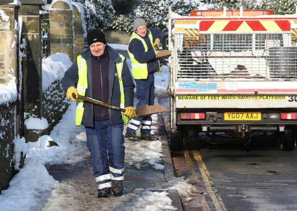 Calderdale Council workers gritting the pavement, Savile Park Road, Halifax.