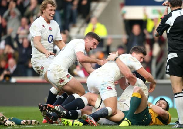 England's Ben Morgan (right) celebrates with Billy Twelvetrees (left), George Ford (centre) and Ben Youngs after scoring the first try during the QBE International match at Twickenham, London. PRESS ASSOCIATION Photo. Picture date: Saturday November 29, 2014. See PA Story RUGBYU England. Photo credit should read: Lynne Cameron/PA Wire.