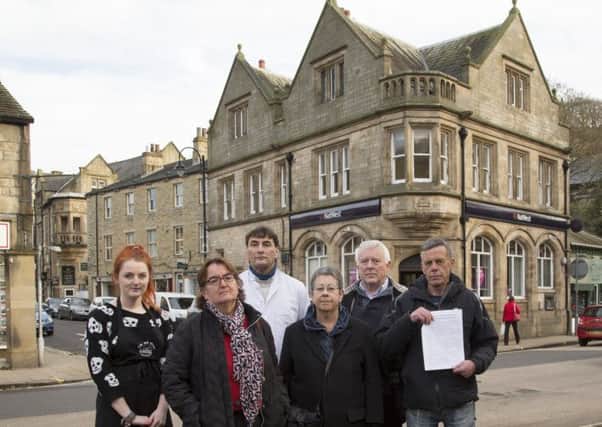 Campaigning against the closure of the NatWest bank, Hebden Bridge. From the left, Ella Wilson from Pennine Provisions, councillor Janet Battye, butcher Stephen Maskill, councillor Ali Miles, councillor Steve Sweeney and Bill Deakin from Silly Billy's.