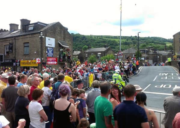 Crowds line the Tour de France route in Mytholmroyd