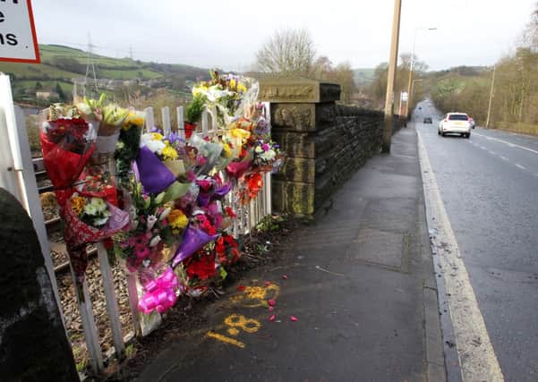 Floral tribute to a 16-year-old girl who was killed after being hit by a train in Hipperholme