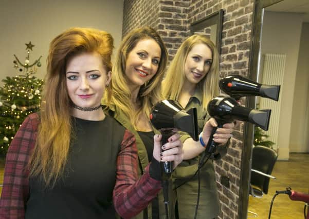Blow-dry marathon for Overgate Hospice and Forget Me Not Children's Hospice at Raw Hairdressing, Brighouse. From the left, Erin Drinnan, Shelley Greenwood and Laura Blackburn.