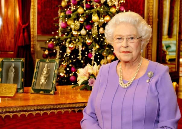 Queen Elizabeth II stands in the State Dining Room of Buckingham Palace, London, after recording her Christmas Day television broadcast to the Commonwealth.