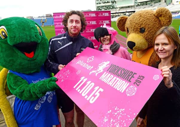 Yorkshire's Ryan Sidebottom with Caroline Richardson of sponsors Plusnet, and mascots from many of the partner charities, at the launch of the Yorkshire Marathon 2015.Picture Scott Merrylees SM1006/51a